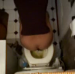 An overhead camera captures a woman pooping on a toilet with a voyeuristic flavor. Full audio included.